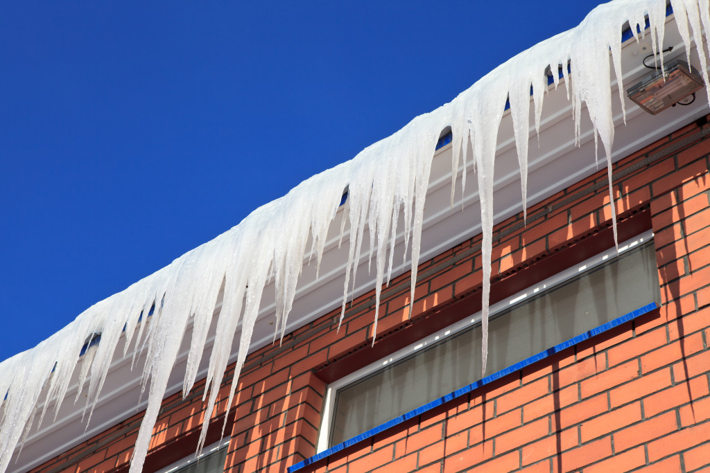 Image of roof with excessive icicles hanging off.